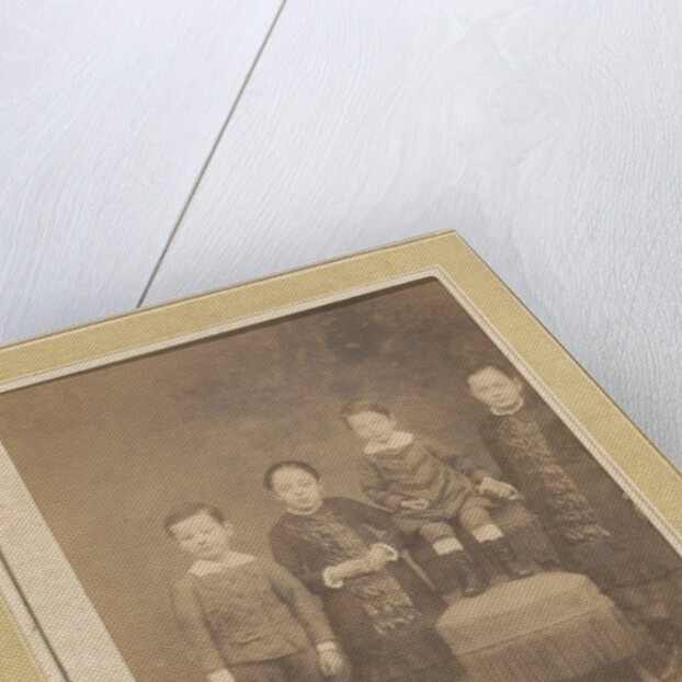 Portrait of four children in a chair by Anonymous