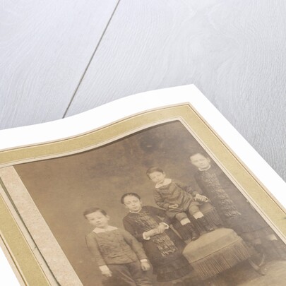 Portrait of four children in a chair by Anonymous