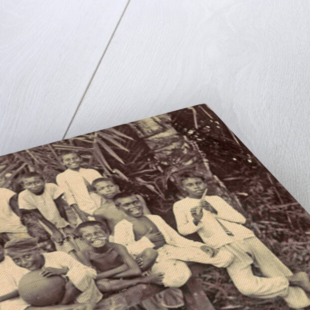 Laughing children with flute, ball and bicycle in Ambon, Indonesia by Anonymous