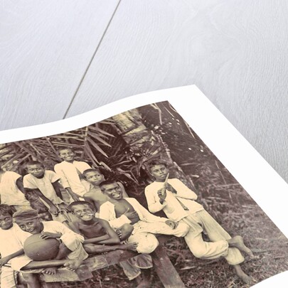 Laughing children with flute, ball and bicycle in Ambon, Indonesia by Anonymous