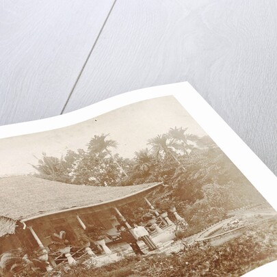 Man and woman posing for a house with a garden in Ambon, Indonesia by Anonymous