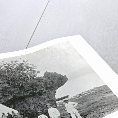 Group of people at rock formation Stone Hat (Batu Tjepeh) in Ambon, Indonesia by Anonymous