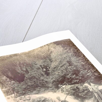 Guitar playing man at a waterfall at Batu Gantong in Ambon, Indonesia by Anonymous