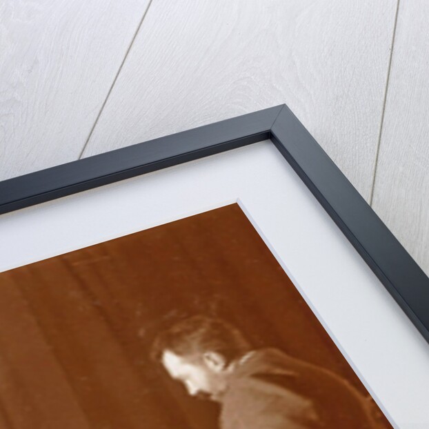 Men and women playing a board game in a living room by Anonymous