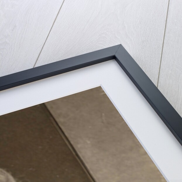 woman writing at a table by Anonymous