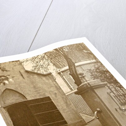 Pump on a church square by Anonymous