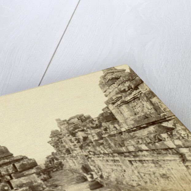 Indian man on a relationship of Borobudur in Java, Indonesia by Anonymous