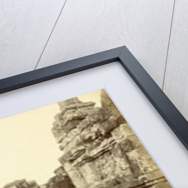 Indian man on a relationship of Borobudur in Java, Indonesia by Anonymous