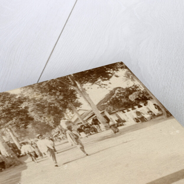 Street scene in the Dutch East Indies with passersby and shops by Anonymous
