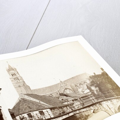 View of a gate, a bridge and a church in Bruges, Belgium by Victor Daveluy