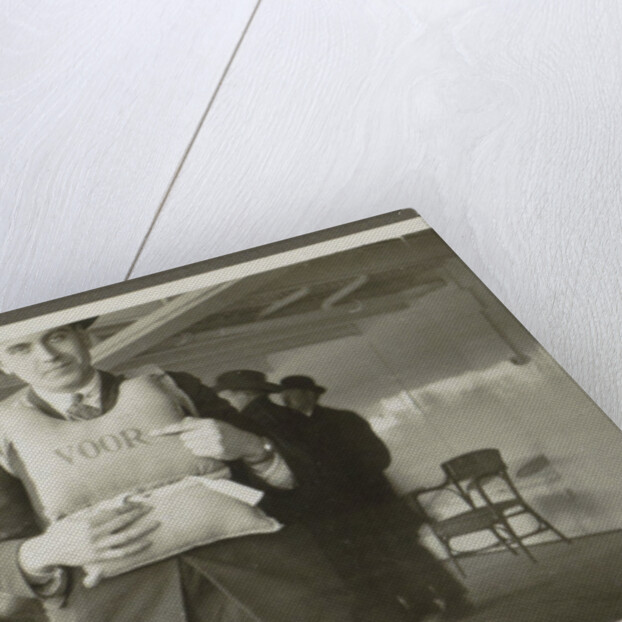 Two men wearing life jackets on board a ship by Anonymous