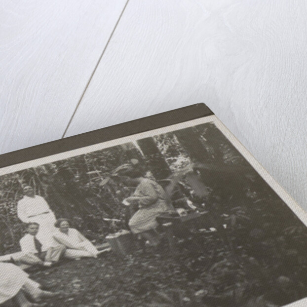 Group of men and women in a forest by Anonymous