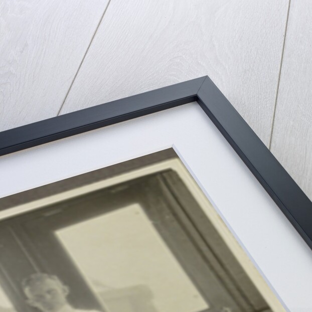Five men in tropical attire sitting around a table by Anonymous