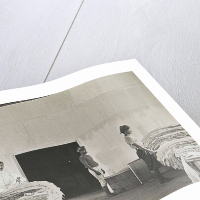 Sumatra indonesia natives sort the rubber in barn by Anonymous