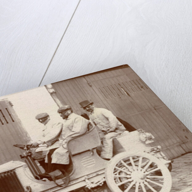 Three men with big sunglasses in an open car by Anonymous