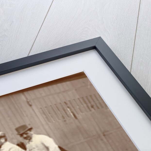 Three men with big sunglasses in an open car by Anonymous