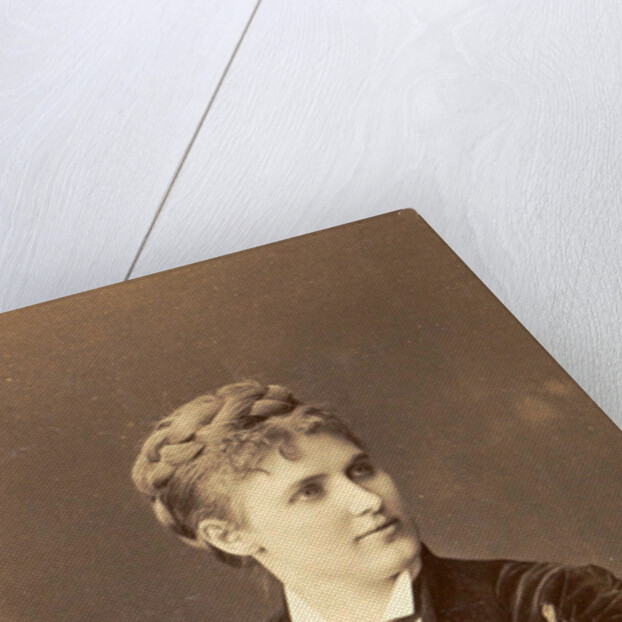 Studio Portrait of a woman sitting on a chair with curved back by Anonymous