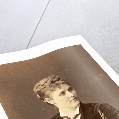 Studio Portrait of a woman sitting on a chair with curved back by Anonymous