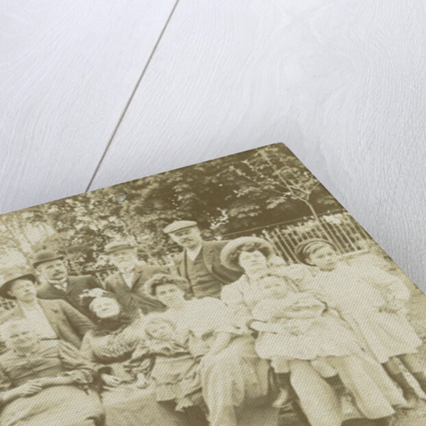 Family portrait of three generations in a garden by Anonymous