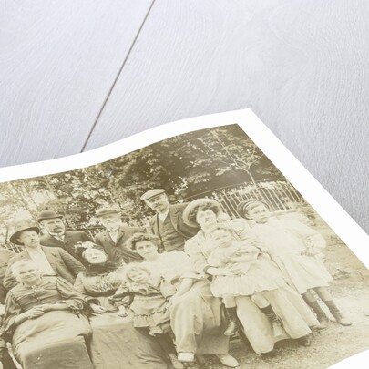 Family portrait of three generations in a garden by Anonymous