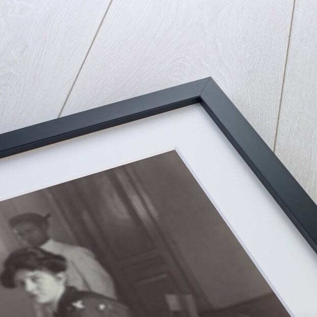 Group portrait of young women at the table with servants in the Dutch East Indies, indonesia by Anonymous
