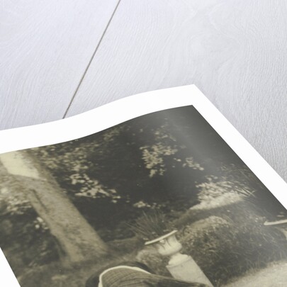 Woman with a dog in a garden by Anonymous