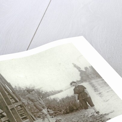 Two women at a stairway on the bank of a river or lake by Anonymous