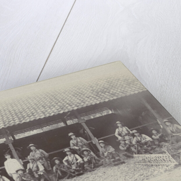 Group portrait of KNIL soldiers with machine guns for a stable by Lik Sun Bros