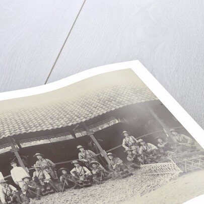 Group portrait of KNIL soldiers with machine guns for a stable by Lik Sun Bros