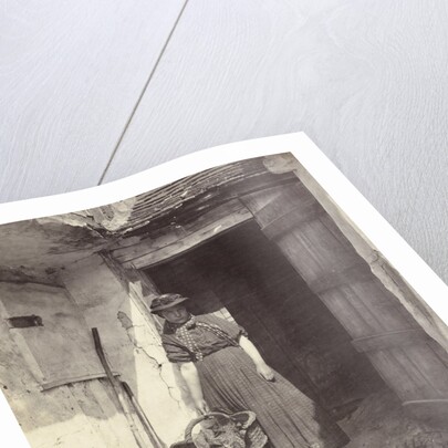 Portrait of a young woman in a doorway by Anonymous