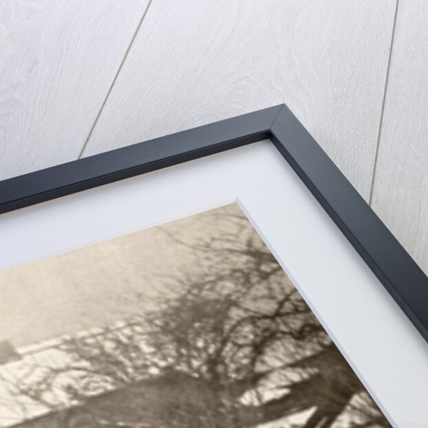 Woman on a bridge in a winter landscape by Peter Henry Emerson