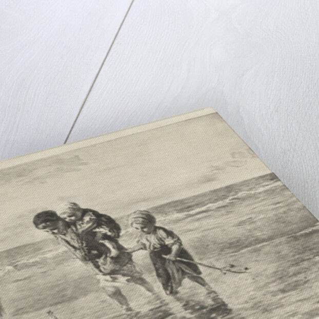 Four children playing with toy boat on the beach in shallow seawater by Jozef Israëls
