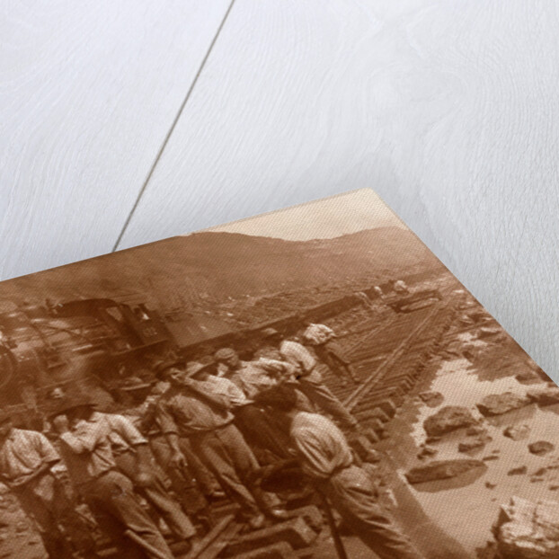 Spanish laborers at work in Culebra Cut and loaded train hauling dirt from canal, USA by Anonymous