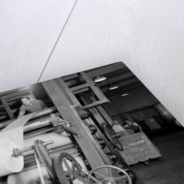 Mt. Holyoke, Massachusetts - Paper. American Writing Paper Co. Super-calender - putting on roll, starting operation, 1936 by Lewis Hine