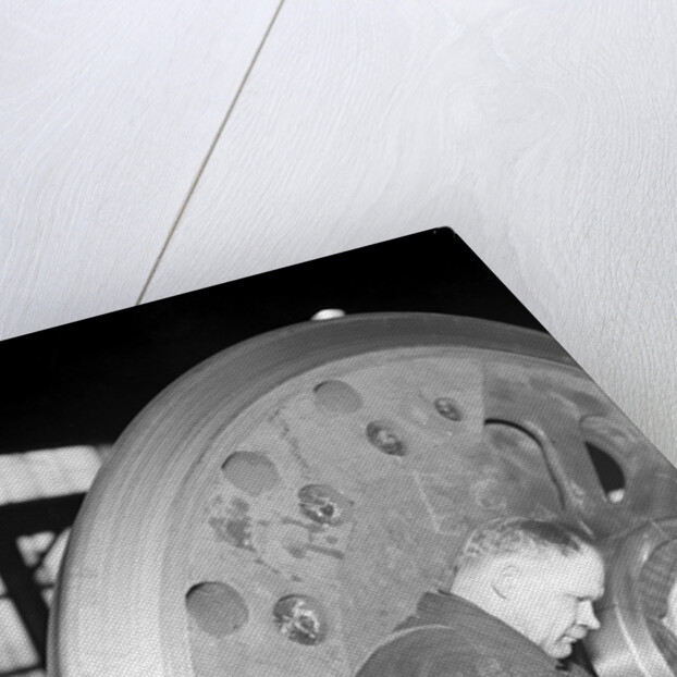 Eddystone, Pennsylvania - Railroad parts. Machinist finishing axle on large driving wheels on newest type of locomotive, March 1937 by Lewis Hine