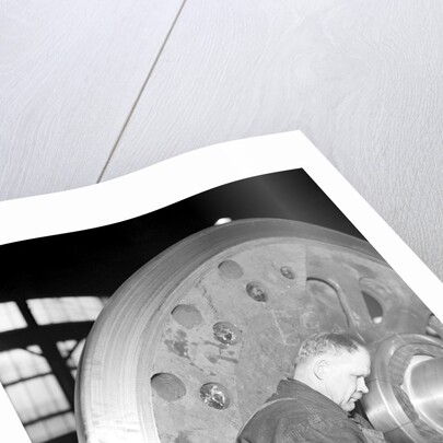 Eddystone, Pennsylvania - Railroad parts. Machinist finishing axle on large driving wheels on newest type of locomotive, March 1937 by Lewis Hine