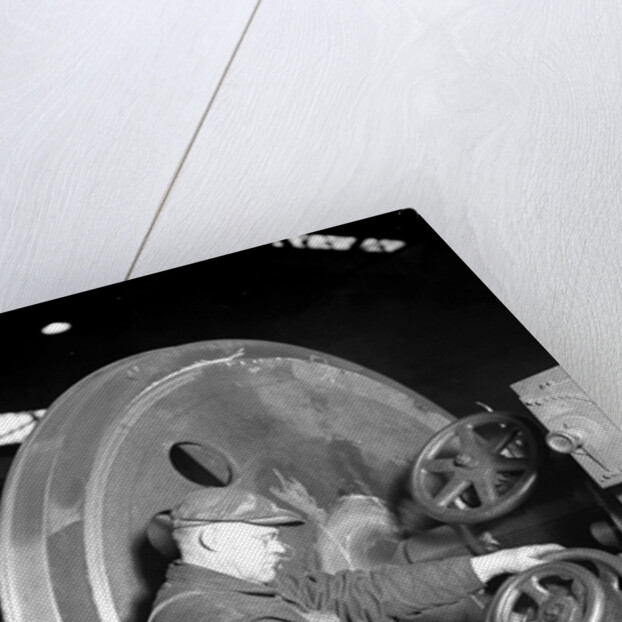 Eddystone, Pennsylvania - Railroad parts. Machinist machining wheel to fit driving pin on above wheels on newest type of locomotive, March 1937 by Lewis Hine