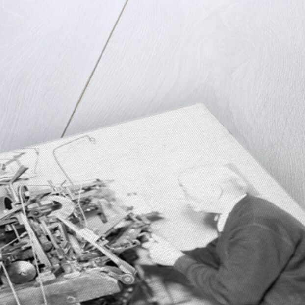 Philadelphia, Pennsylvania - Hosiery. Minnesac Mills. Man working at machine., May 1937 by Lewis Hine