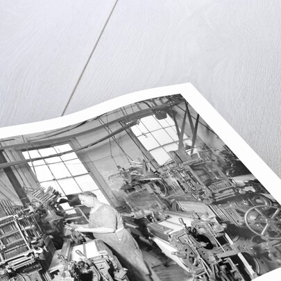 Paterson, New Jersey - Textiles. Weaver operating four-loom system. He is shown removing a used-up quill from the shuttle, 1936 by Lewis Hine