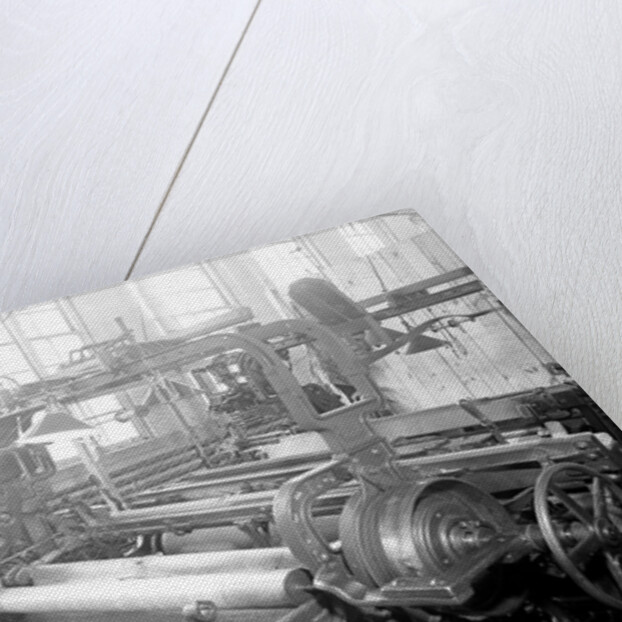Paterson, New Jersey - Textiles. Idle quilling machines and looms in a cockroach shop. Note partition on the right and chicken-wire in the front, March 1937 by Lewis Hine