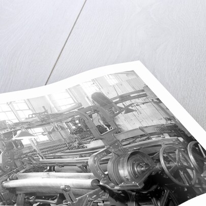 Paterson, New Jersey - Textiles. Idle quilling machines and looms in a cockroach shop. Note partition on the right and chicken-wire in the front, March 1937 by Lewis Hine