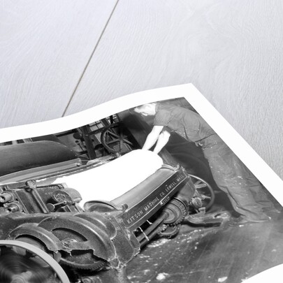 Millville, New Jersey - Textiles. Millville Manufacturing Co. Man rolling fabric, 1936 by Lewis Hine