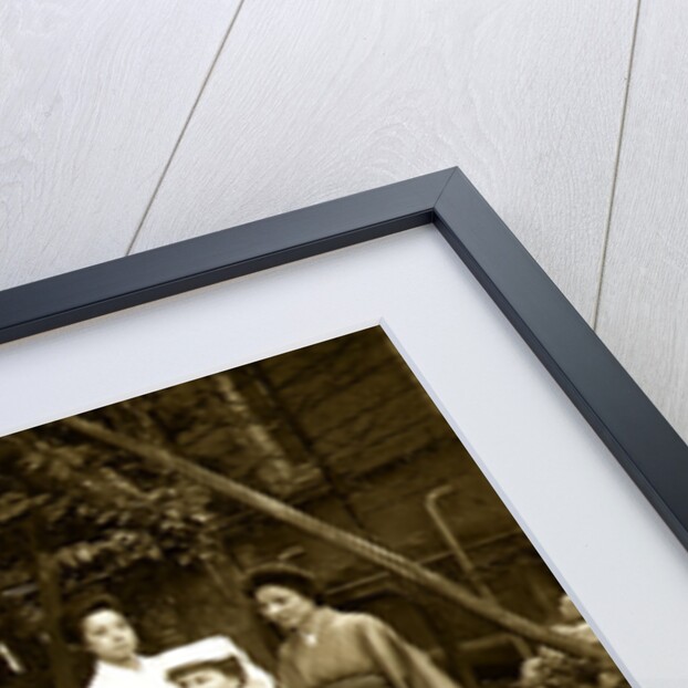 A western Red Cross female doctor(?) and two Japanese women posed in a garden by Anonymous