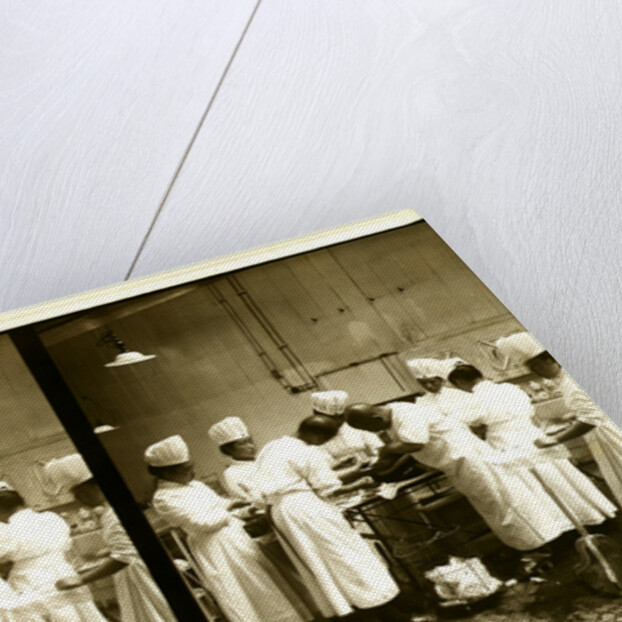 Japanese doctors operating on a patient's wound by Anonymous