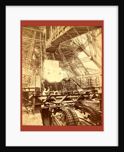 Eiffel Tower Machinery with a Man Beside the Wheel that Raises Elevator by Anonymous