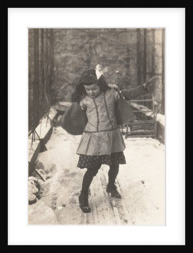 Marba Titzenthaler, daughter of the photographer, gliding over the snow on the roof terrace of the house Friedrichstrasse, Berlin, Germany by Waldemar Titzenthaler