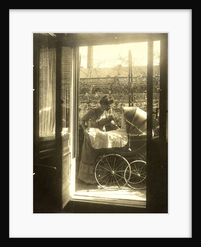 Unidentified woman standing near a pram on a balcony of the house Friedrichstrasse Berlin, Germany by Waldemar Titzenthaler