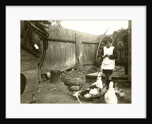 Eckart Titzenthaler, son of the photographer standing on a farm with chickens and geese by Waldemar Titzenthaler