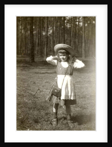 Marba Titzenthaler, daughter of the photographer, standing in front of a forest by Waldemar Titzenthaler