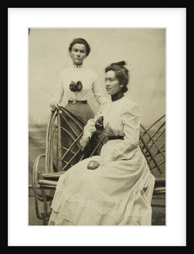 Portrait of two women in front of a backdrop by Anonymous